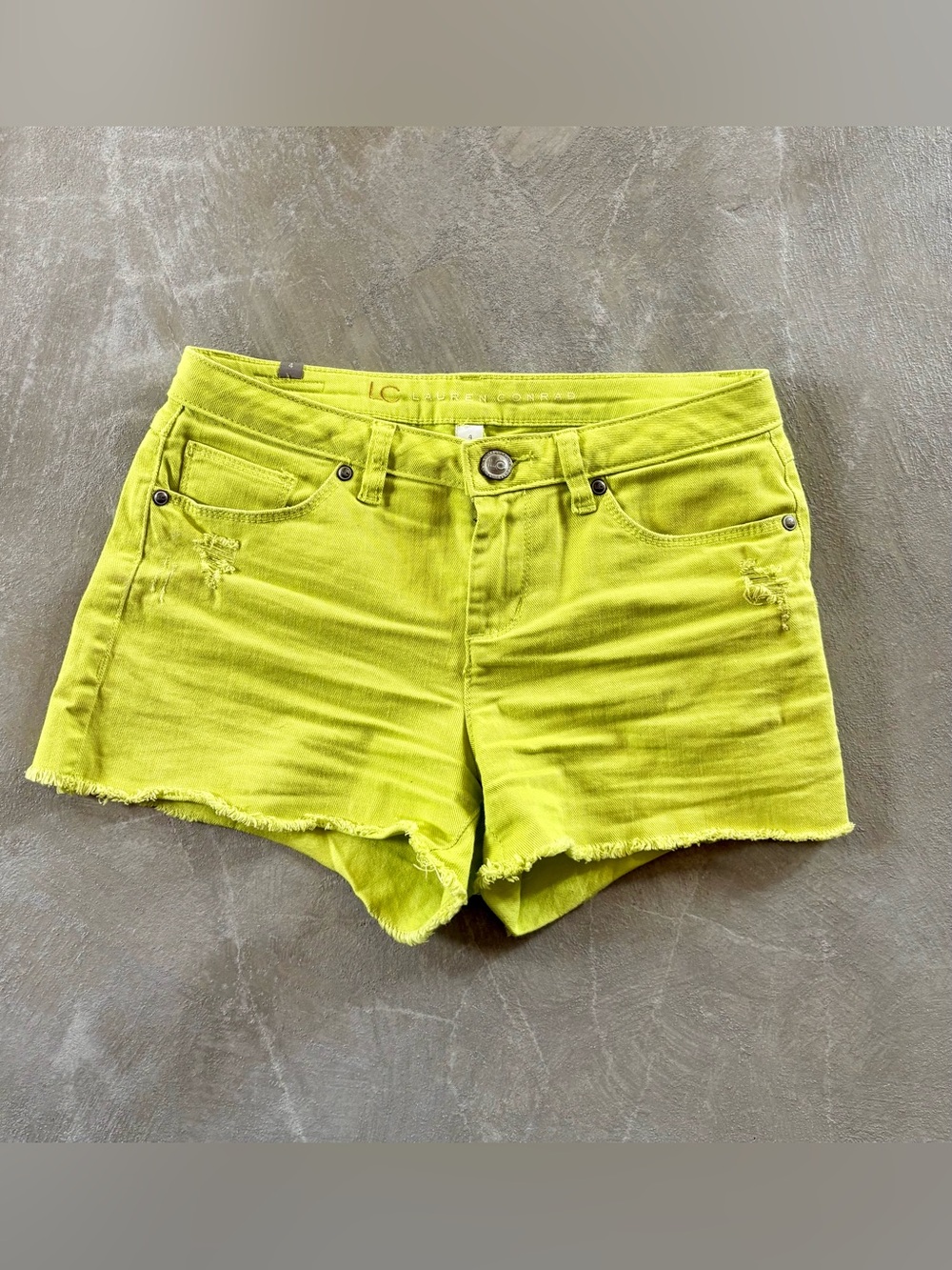 Lauren Conrad frayed hem,distressed denim shorts, sunny lime neon yellow. Size 4